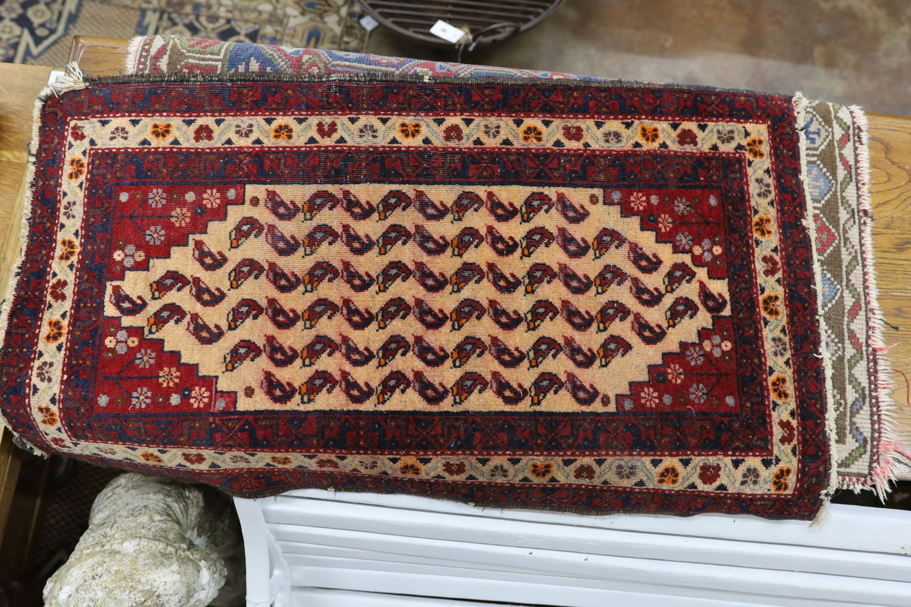 Four Caucasian and North West Persian mats, largest 87 x 88cm